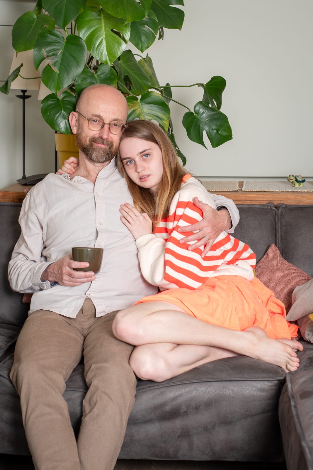 Alexander and their daughter at home